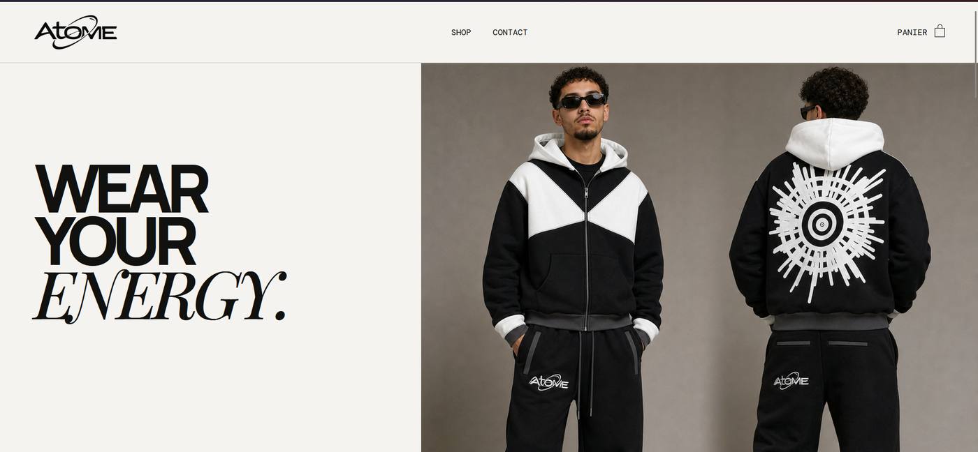 Page d'accueil du site Atome : titre Wear your energy et photos d'un ensemble noir et blanc